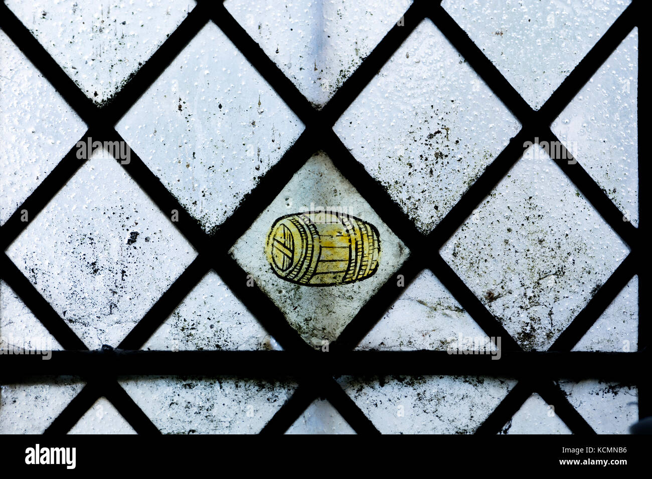 Medieval stained glass of a barrel, St. Wilfrid`s Church, North Muskham, Nottinghamshire, England, UK Stock Photo